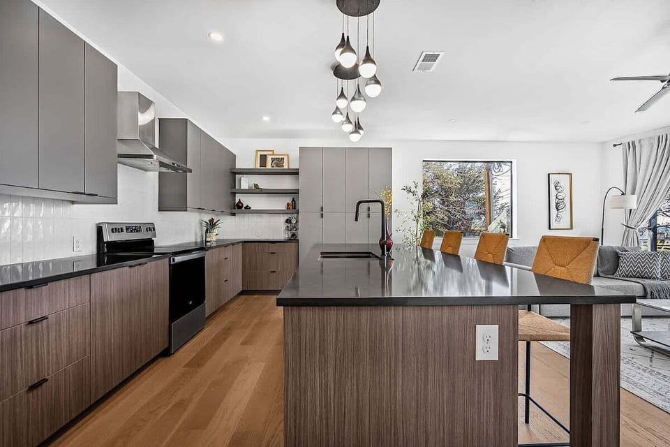 Fully Equipped, Sleek Kitchen with Island and Bar Seating