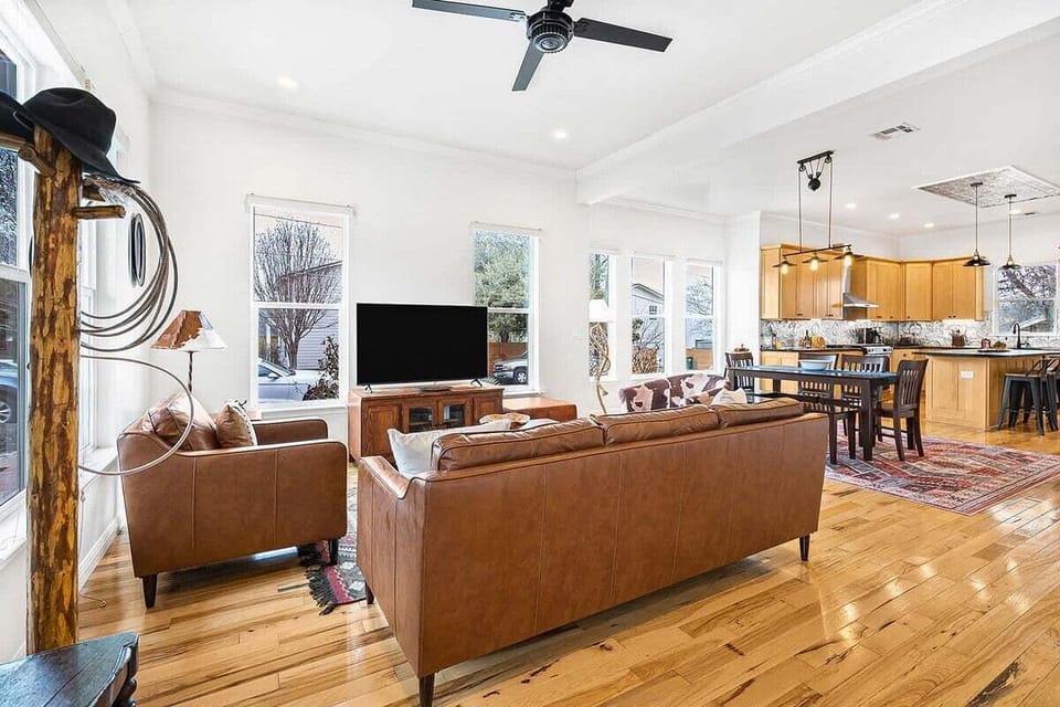 Open Living Area with Leather Sofas and TV