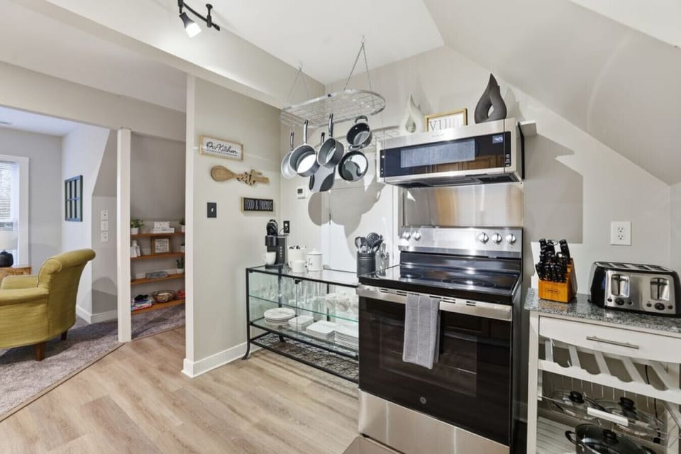 A well‑equipped upstairs kitchen with a compact oven, stove, microwave, Keurig, fridge, freezer, and plenty of cabinet space for all your cooking essentials. Ideal for whipping up breakfast, lunch, or dinner during your stay.