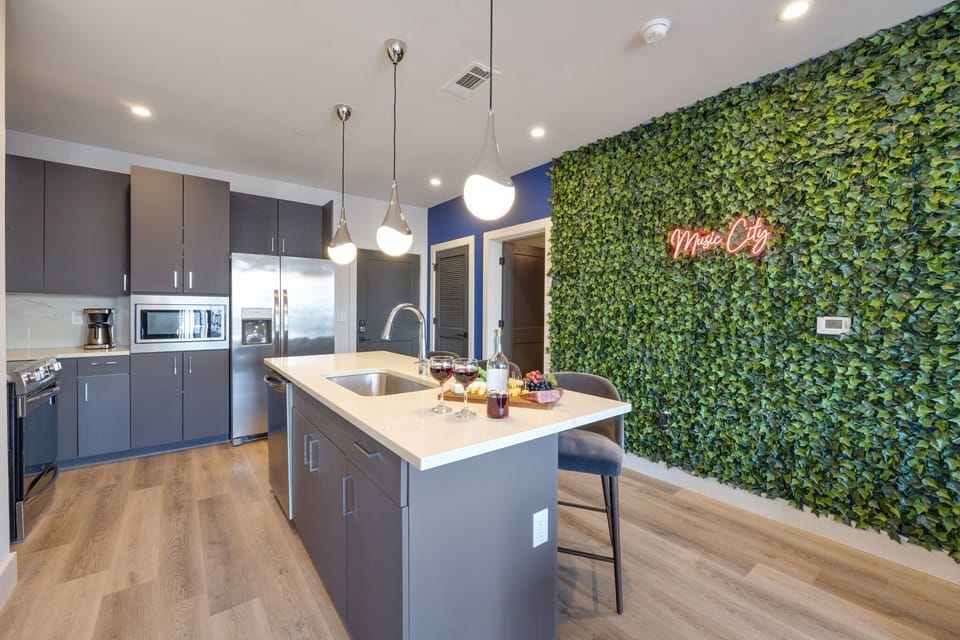 Unit 4: Fully equipped kitchen stocked with your basic cooking essentials, stainless steel appliances, and breakfast bar seating.