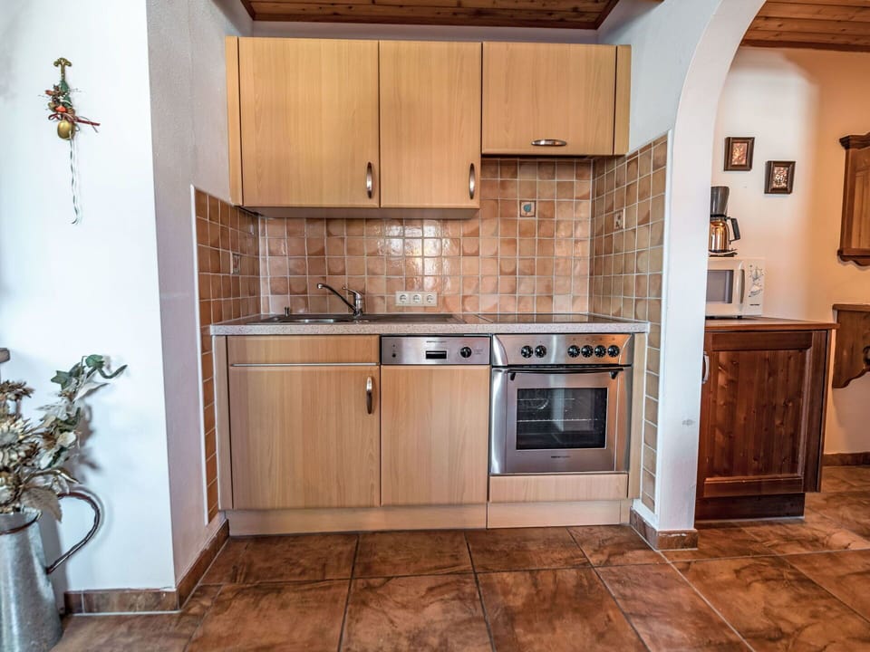 Brown, Cabinetry, Countertop, Property, Building, Kitchen, Kitchen Stove, Wood, Kitchen Appliance, Interior Design