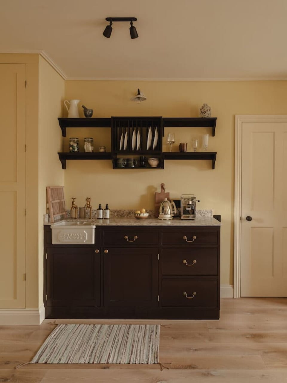 Thoughtfully designed kitchenette with considered details and natural finishes