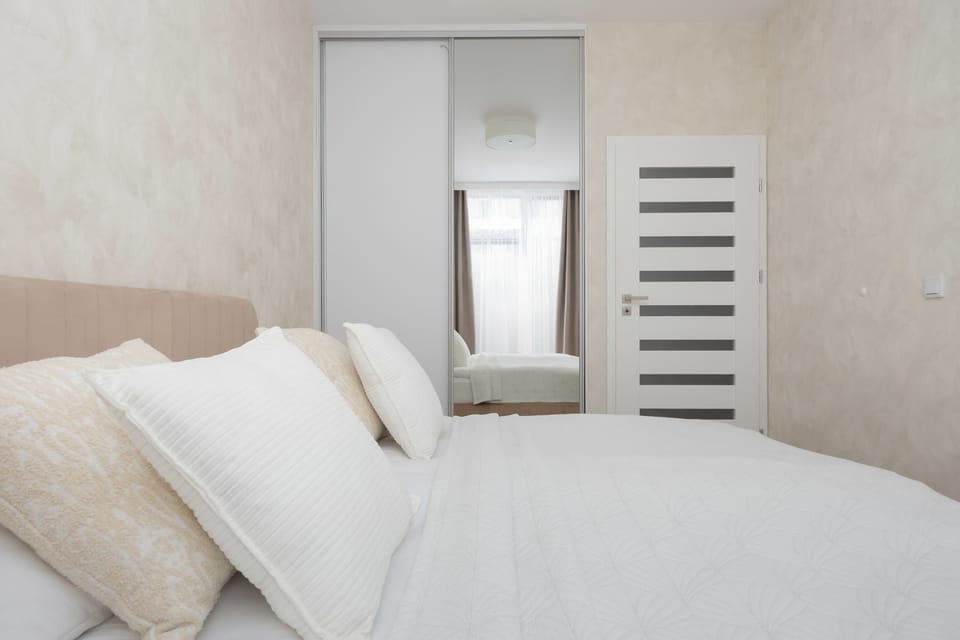 The bedroom's modern design ensures a comfortable stay.