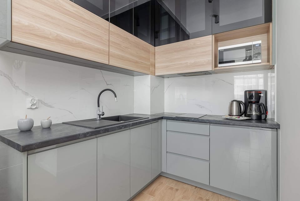 Fully equipped modern kitchen with wooden accents