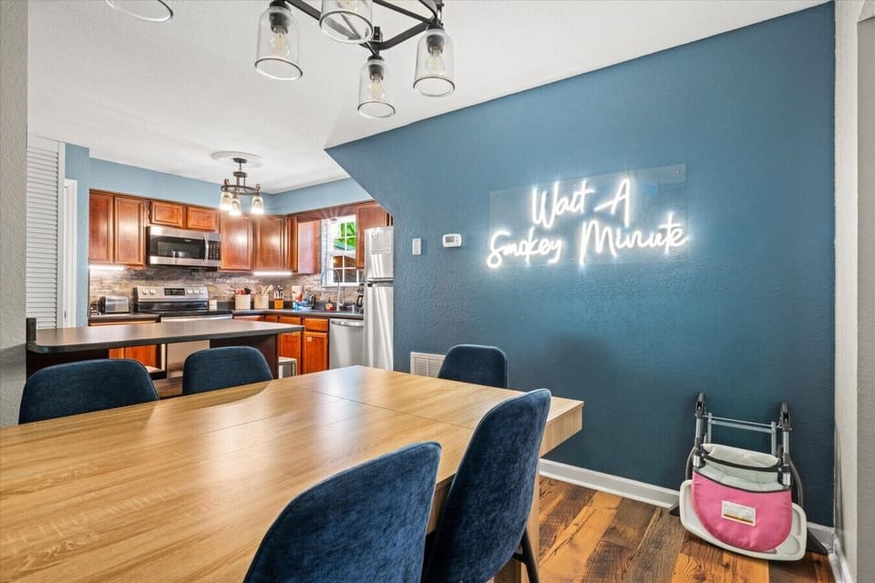 Gather around the spacious dining table to share meals, play board games, or plan your next Smoky Mountain adventure. The open layout keeps everyone connected, with the kitchen just steps away.