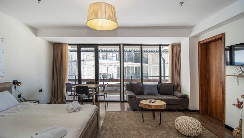 Large windows fill the room with natural light.