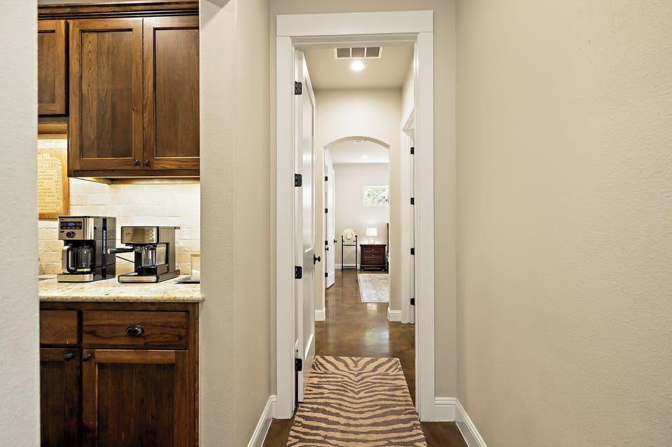 Hallway to butlers kitchen and laundry room
