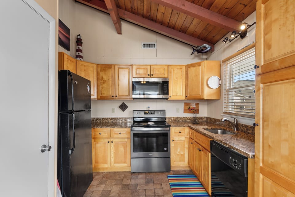 Just off the Living Area is the well-stocked kitchen.