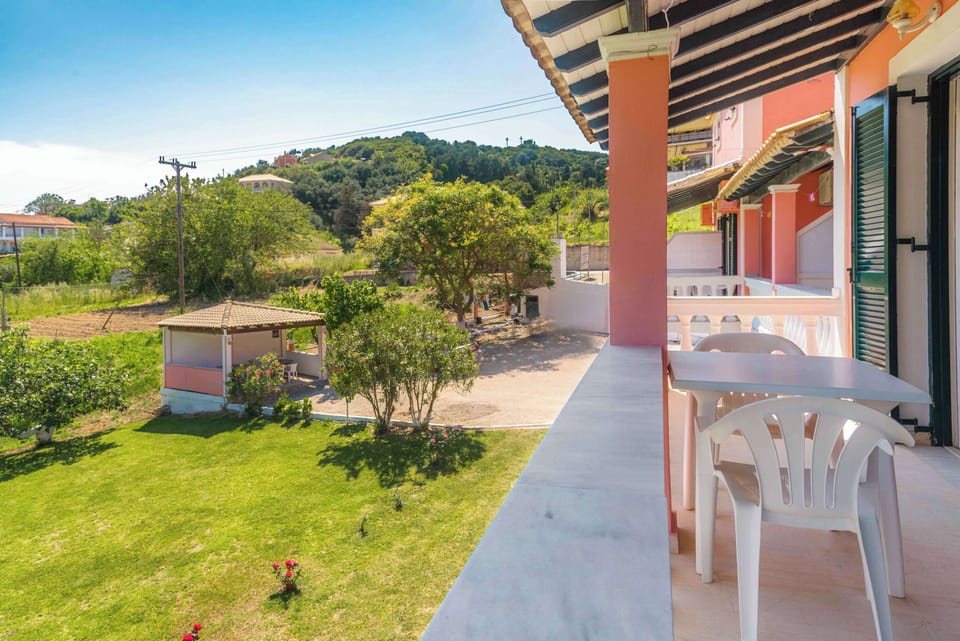 Private Balcony with Outdoor Seating – Relax on your own balcony overlooking the gardens.