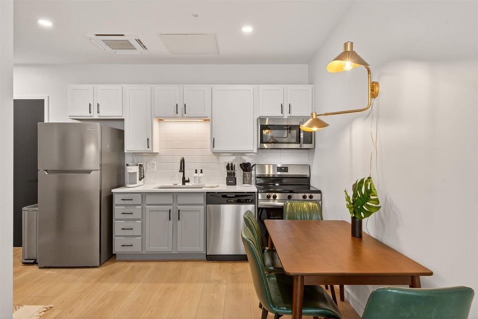 Clean, modern kitchen and dining space ideal for morning coffee, dinner with friends, or working comfortably. 