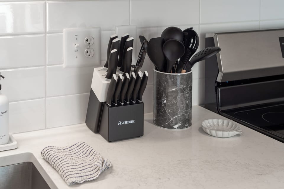 Fully stocked kitchen with quality knives, utensils, and cookware for simple, stress-free meals.