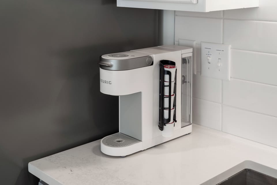 Keurig coffee station stocked with starting pods—perfect for a quick, quality brew before your day begins.
