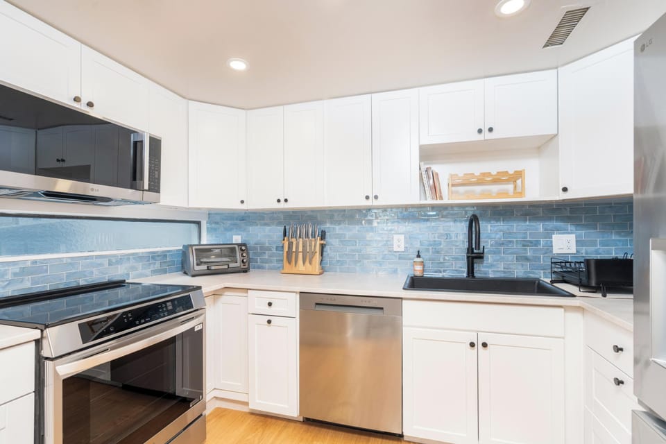 Kitchen - Well appointed kitchen with stainless steel appliances and electric range