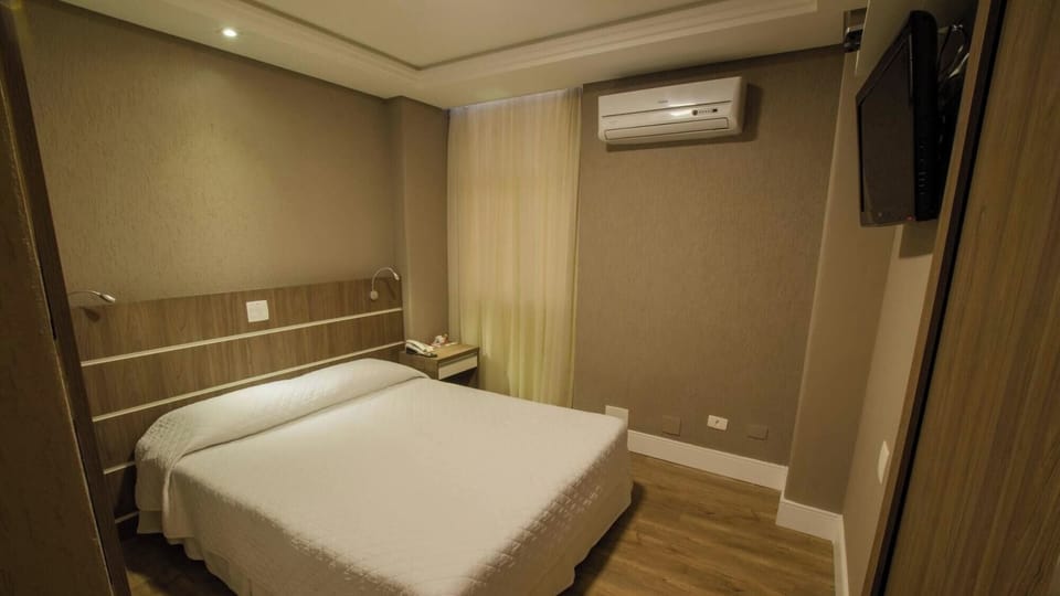 Drift off comfortably in a calm room with cooling air-conditioning.