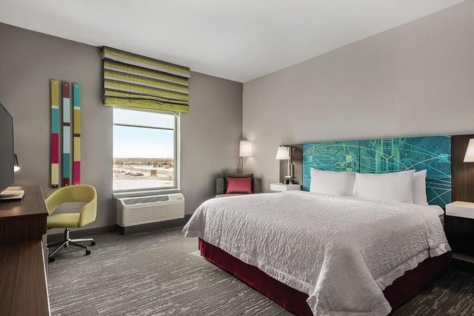Sink into a cloud-soft bed with warm bedside lighting.