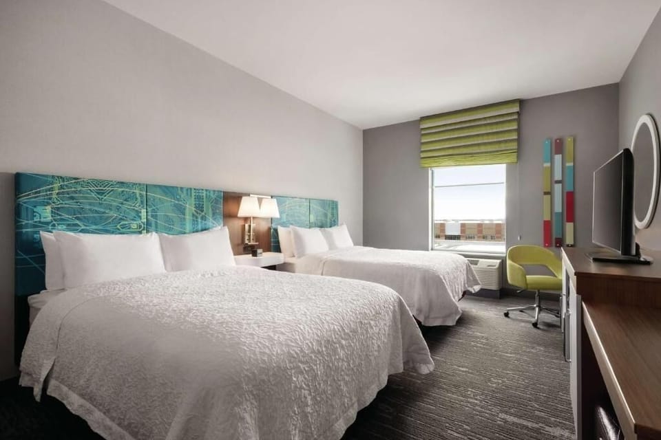 Recharge together with generous floor space and two cozy beds.