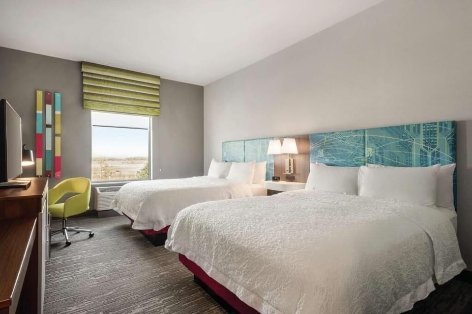 Settle in comfortably with two plush beds and airy room flow.