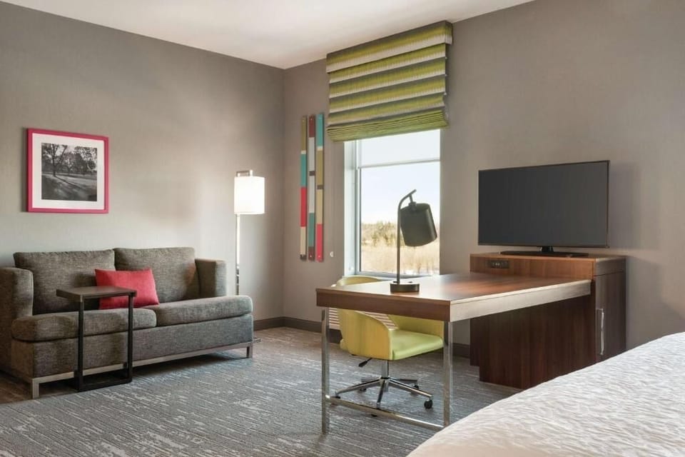 Get productive at the roomy desk, then relax on the sofa.