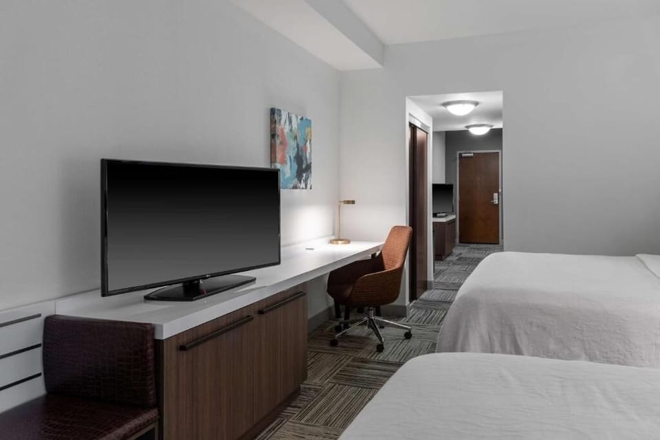 Recharge in a bright room with desk space and HDTV.