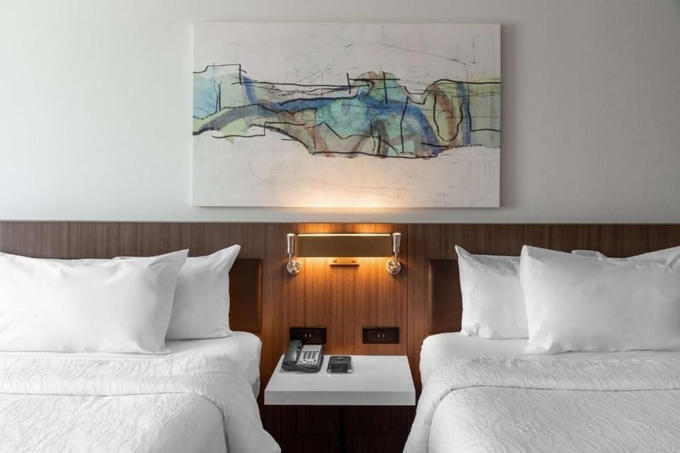 Drift off under warm reading lights and hotel-fresh linens.