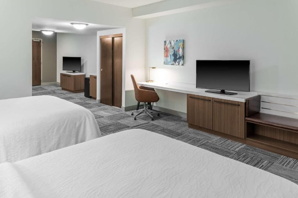 Unwind in a bright double room with desk and TV