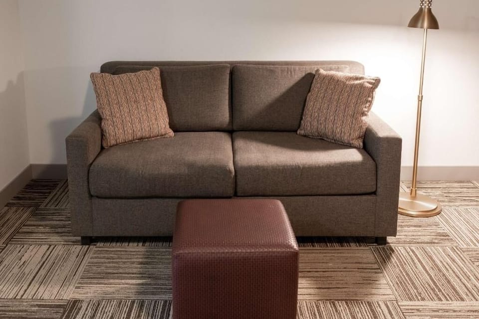 Sink into the sofa and relax under warm reading light.