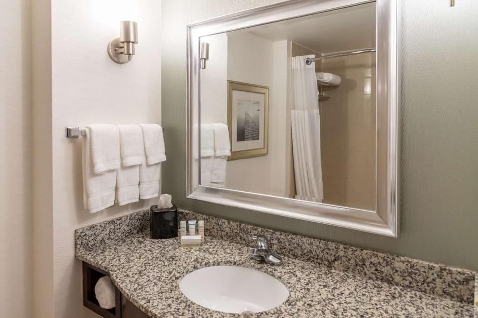 Refresh at the granite vanity with bright, fluffy towels.