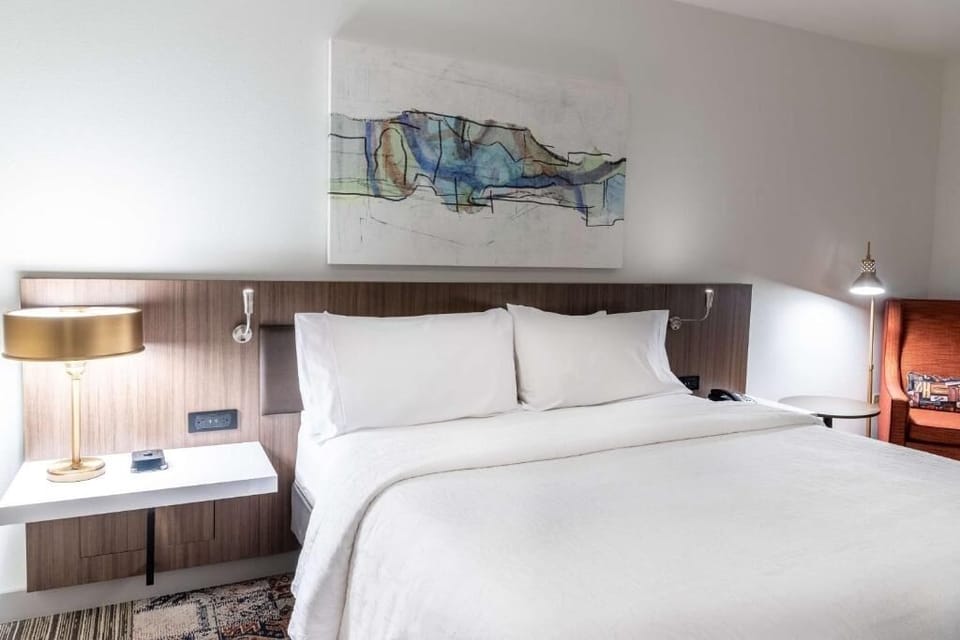 Drift off with bedside lighting and convenient charging nearby.