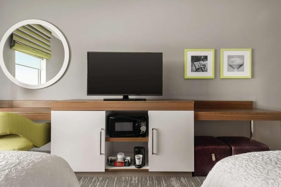Kick back with big-screen entertainment and handy microwave setup.