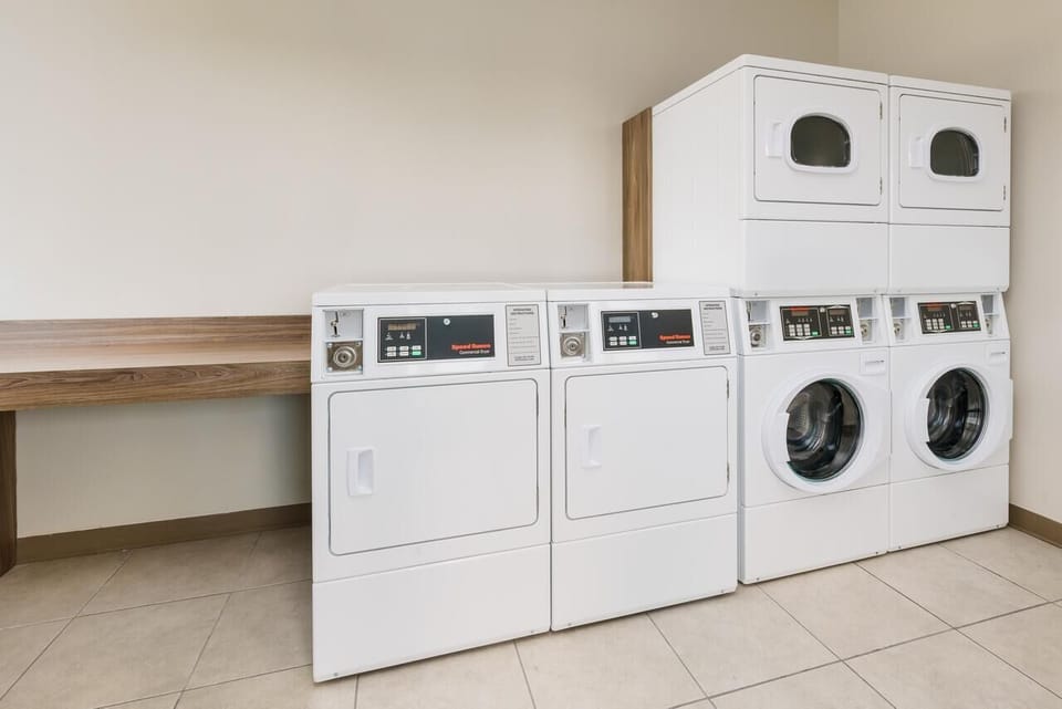 Coin-operated laundry facility