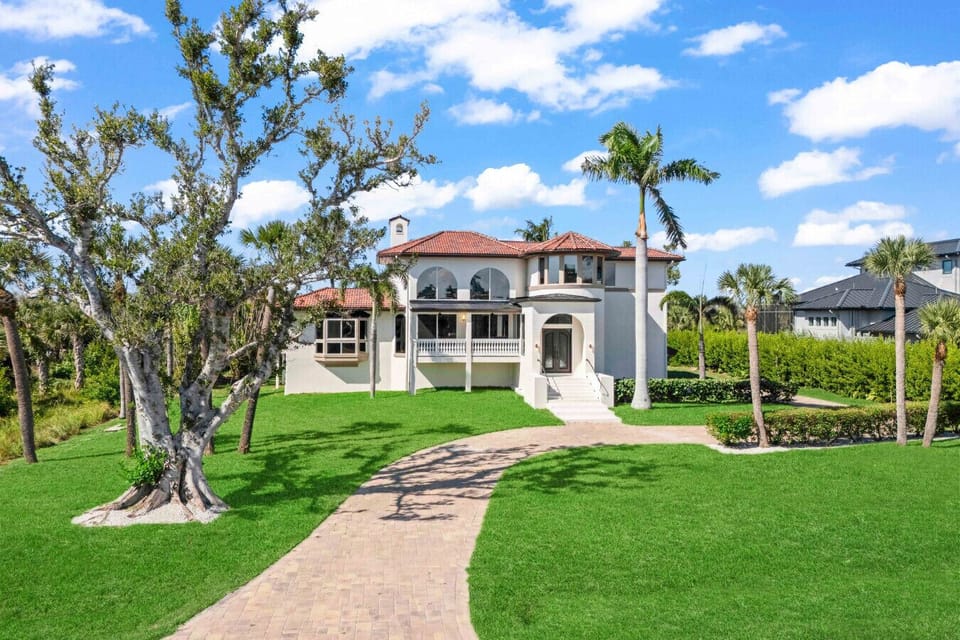 Tropical elegance meets coastal charm out front