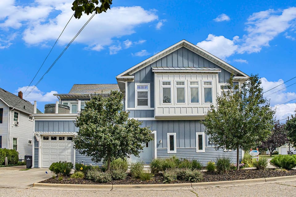 A grand coastal welcome—this stunning multi-level home offers curb appeal and plenty of space for everyone.