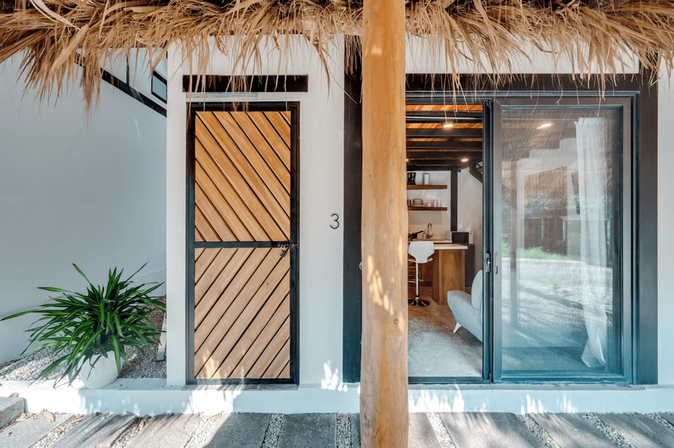 The unit 3 entrance door + bodega door side by side (wood door)