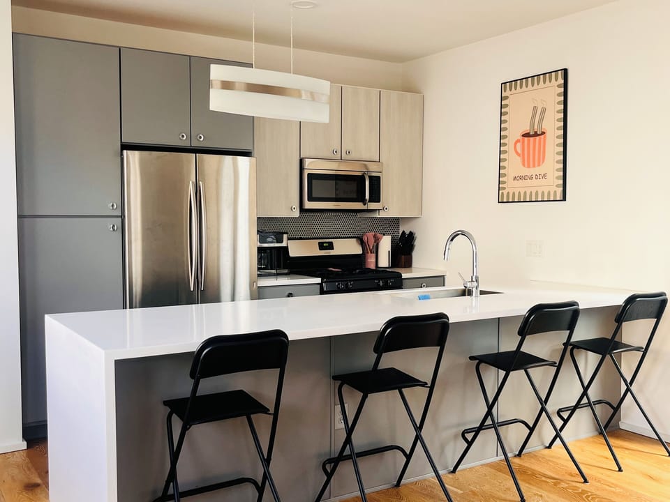 Stocked kitchen w/dishwasher.  Comes with drip or k-cup coffee maker.