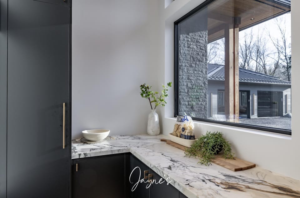 Bright, modern kitchen nook with scenic window views