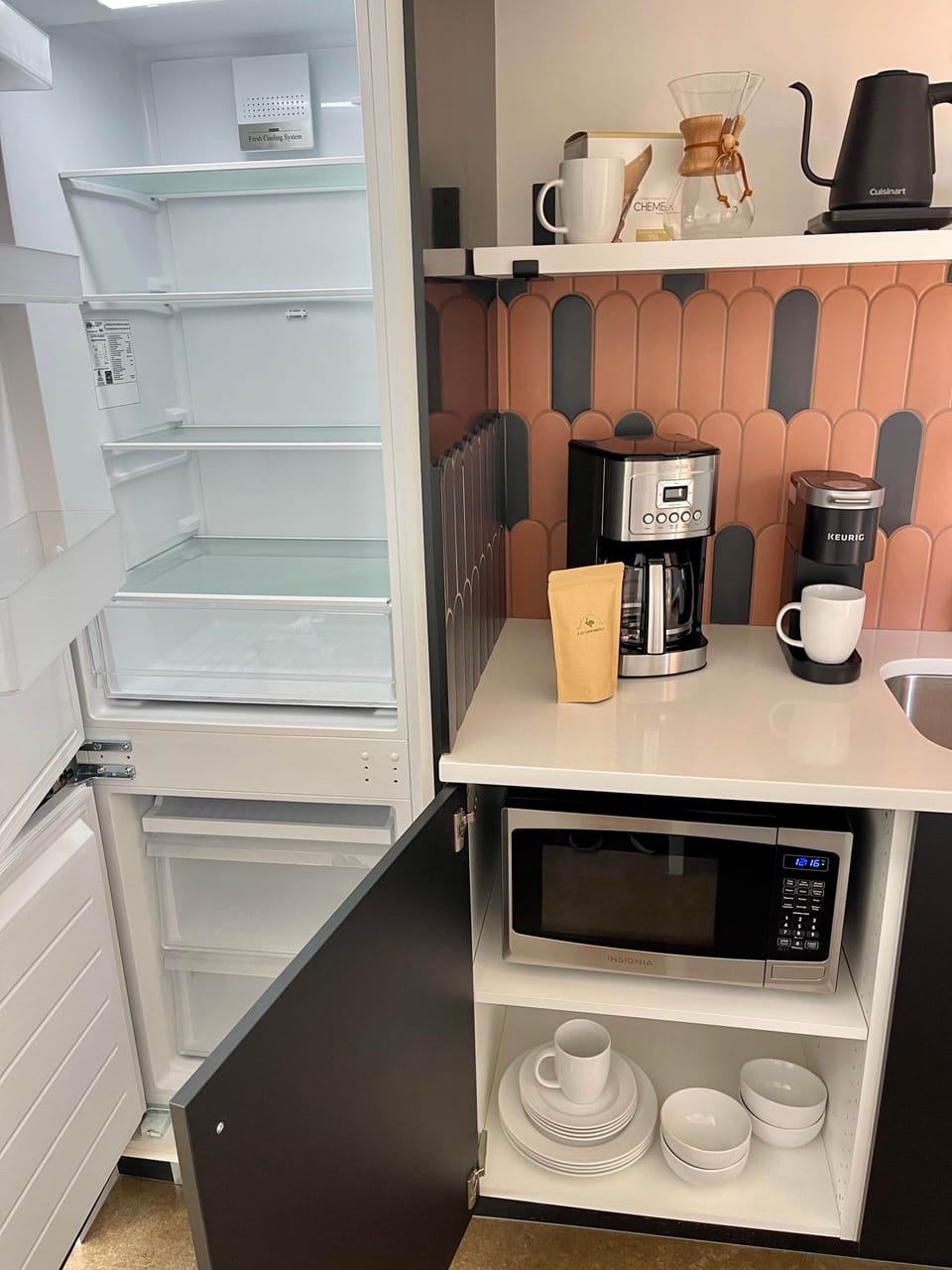 Large fridge and freezer, microwave, toaster, dishes, and all the coffee and tea gear!