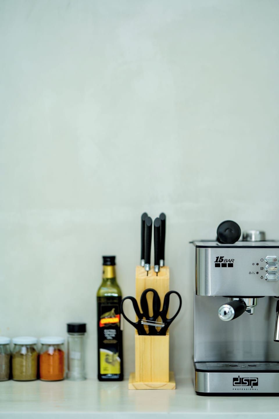 Coffe machine, different utensils and spices 