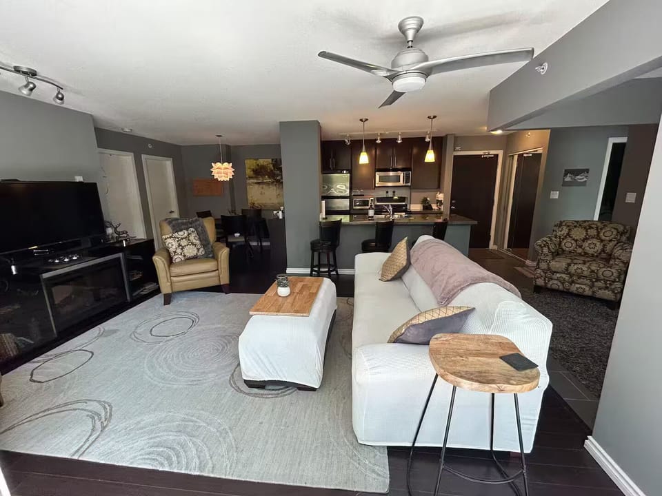 Open concept layout with lots of seating between the bar, living & dining rooms