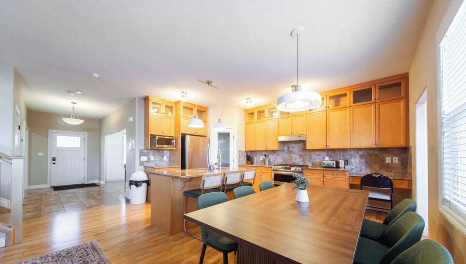 Open kitchen and dining area offering generous seating and a welcoming layout