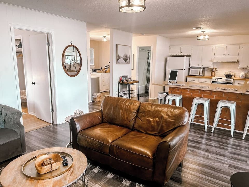 Open concept living room, dining area, and fully stocked kitchen