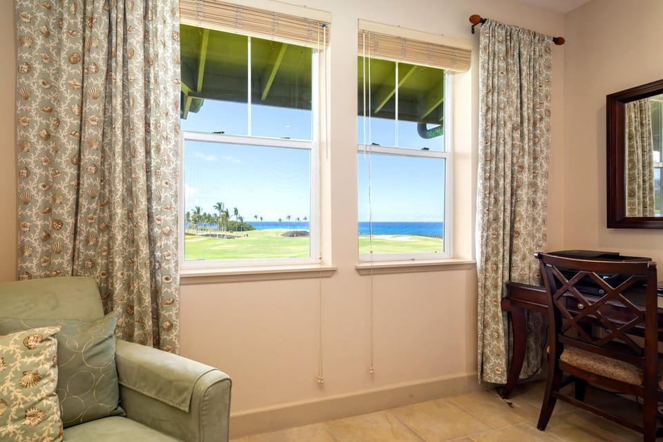 Enjoy the view from bed or your cozy reading chair in this sun-filled suite     HLI-12A