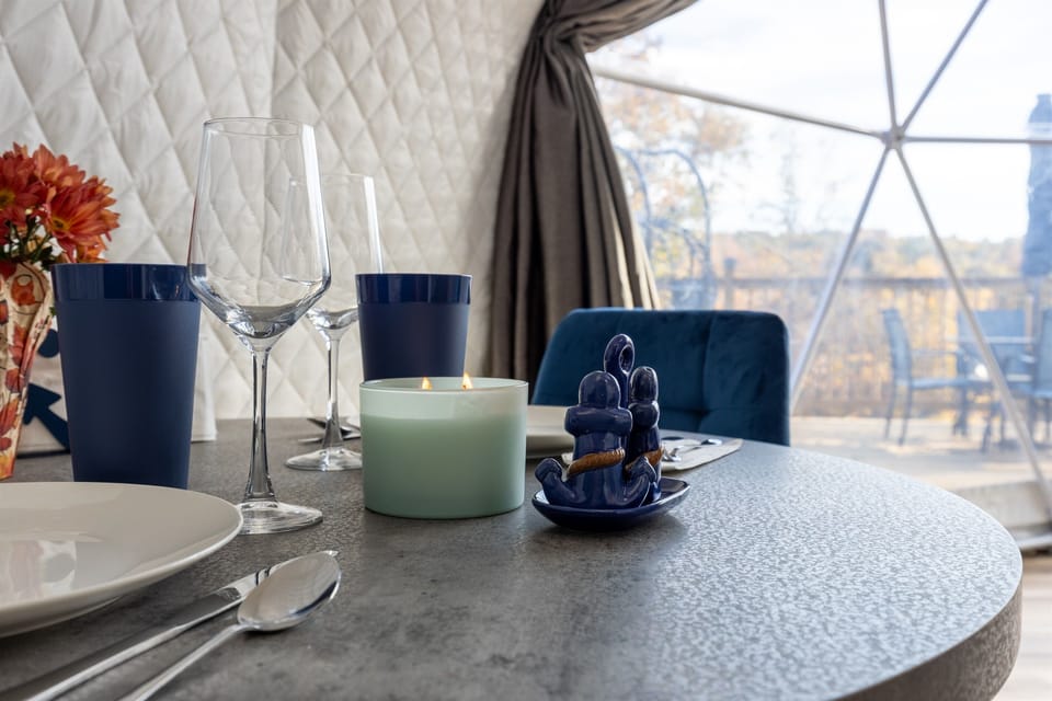 Cozy dining table set for two — perfect for a romantic meal inside your private lakeview dome