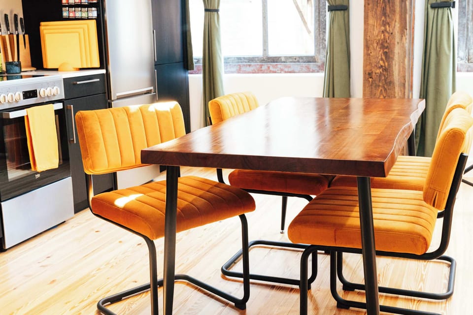 Enjoy a lively conversation with friends around our live edge walnut table. 