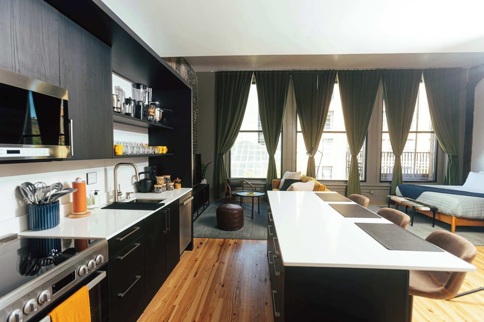 An airy studio layout with designer finishes and plenty of natural light — perfect for relaxing or working.
