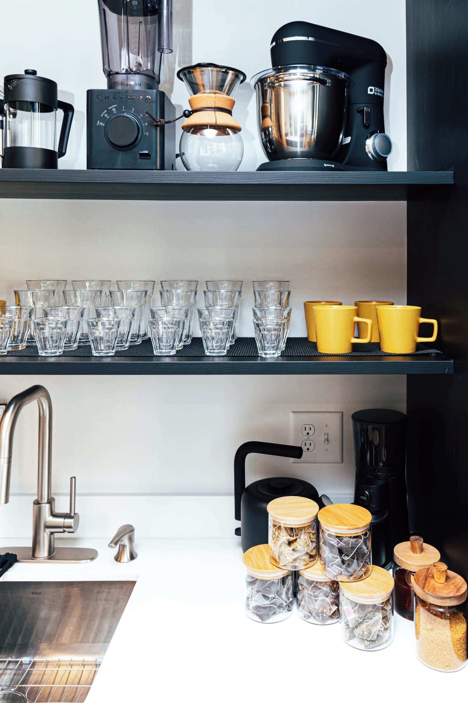Every element is considered — from the stand mixer and blender to hand-selected teas and spices for at-home comfort.
