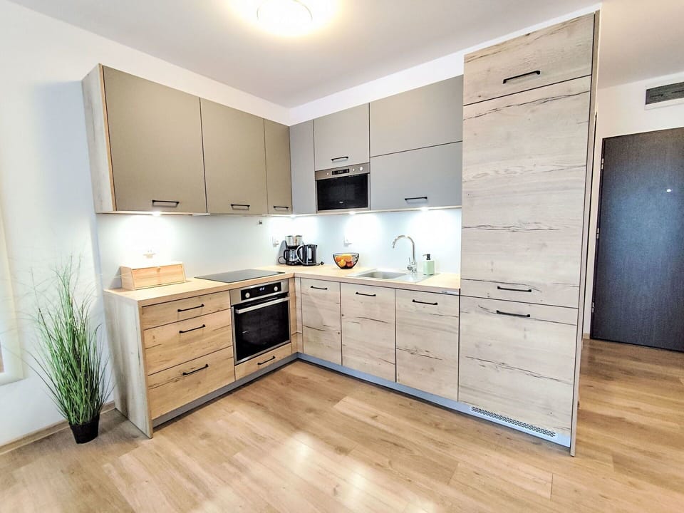 Furniture, Flooring, Cabinetry, Wood, Countertop, Interior Design, Floor, Kitchen, Kitchen Appliance, Drawer