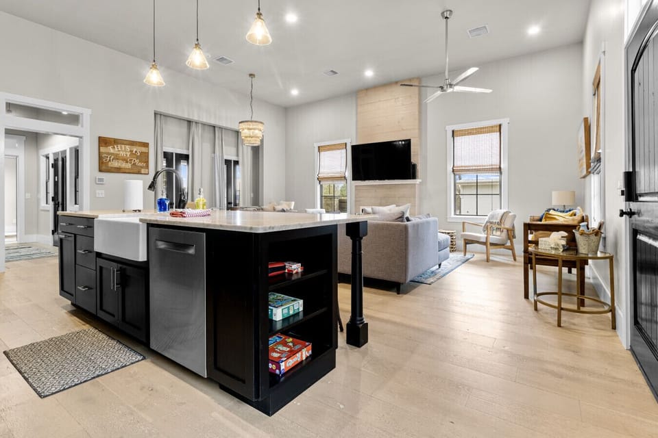 Open concept living room and kitchen with ample seating and smart TV