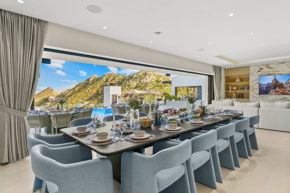 Elegant dining for 14 indoors or alfresco, w/ additional outdoor seating for 16.