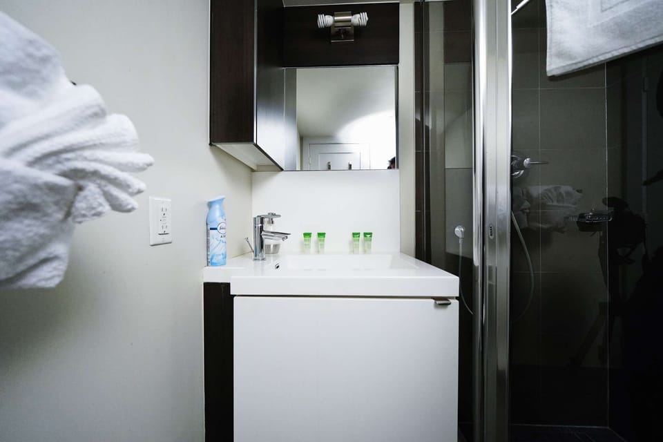 Fresh and fully-equipped bathroom with essential amenities.