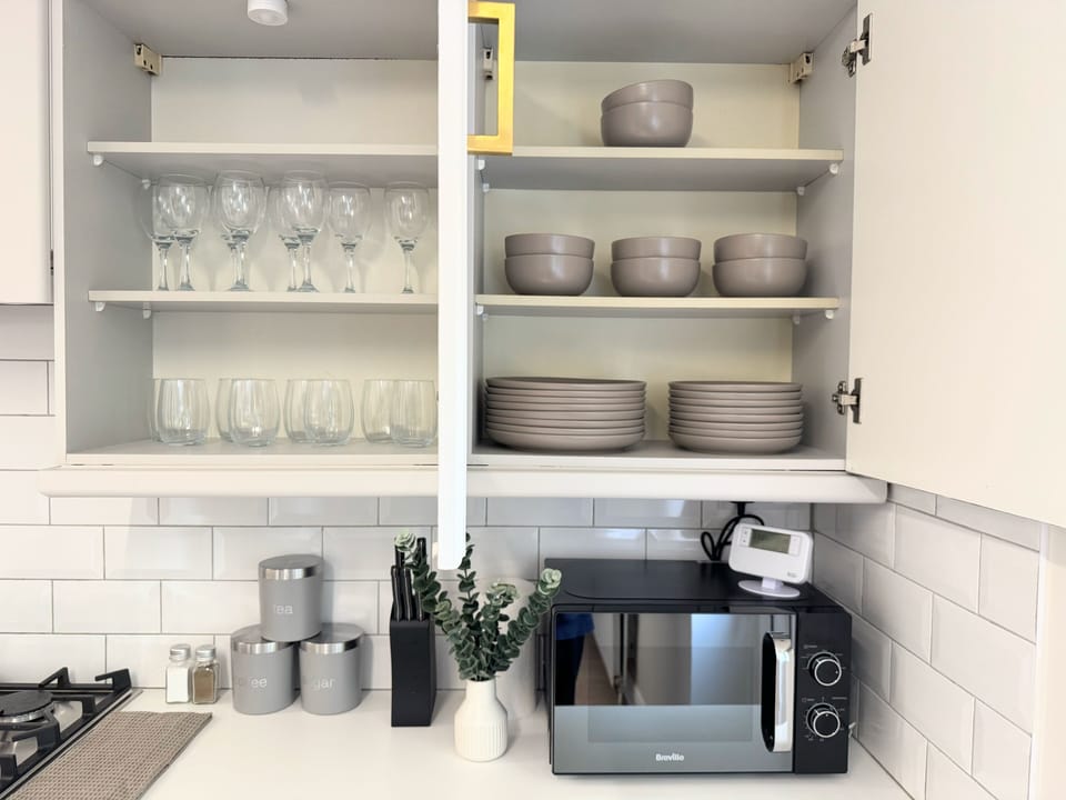 Plenty of dinnerware and glasses